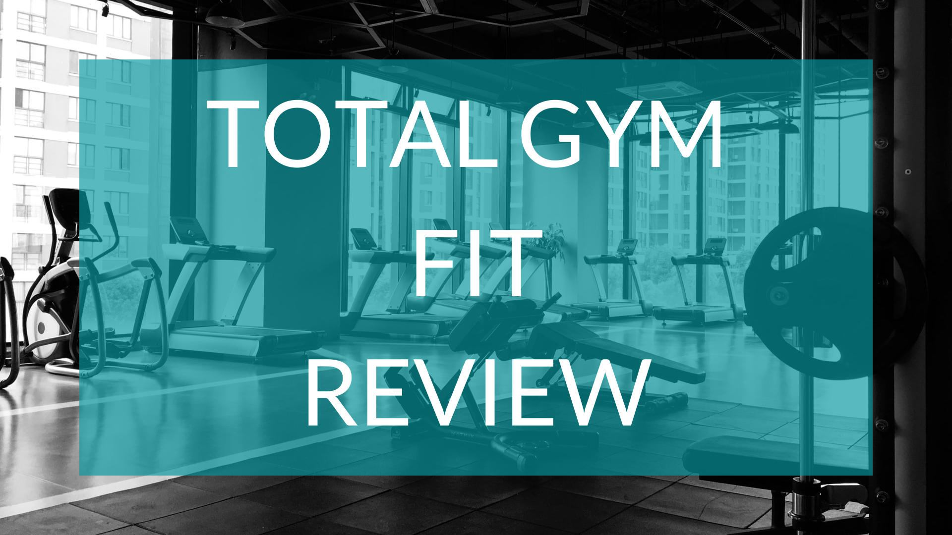 Text read Total Gym Fit Review infront of a gym backdrop