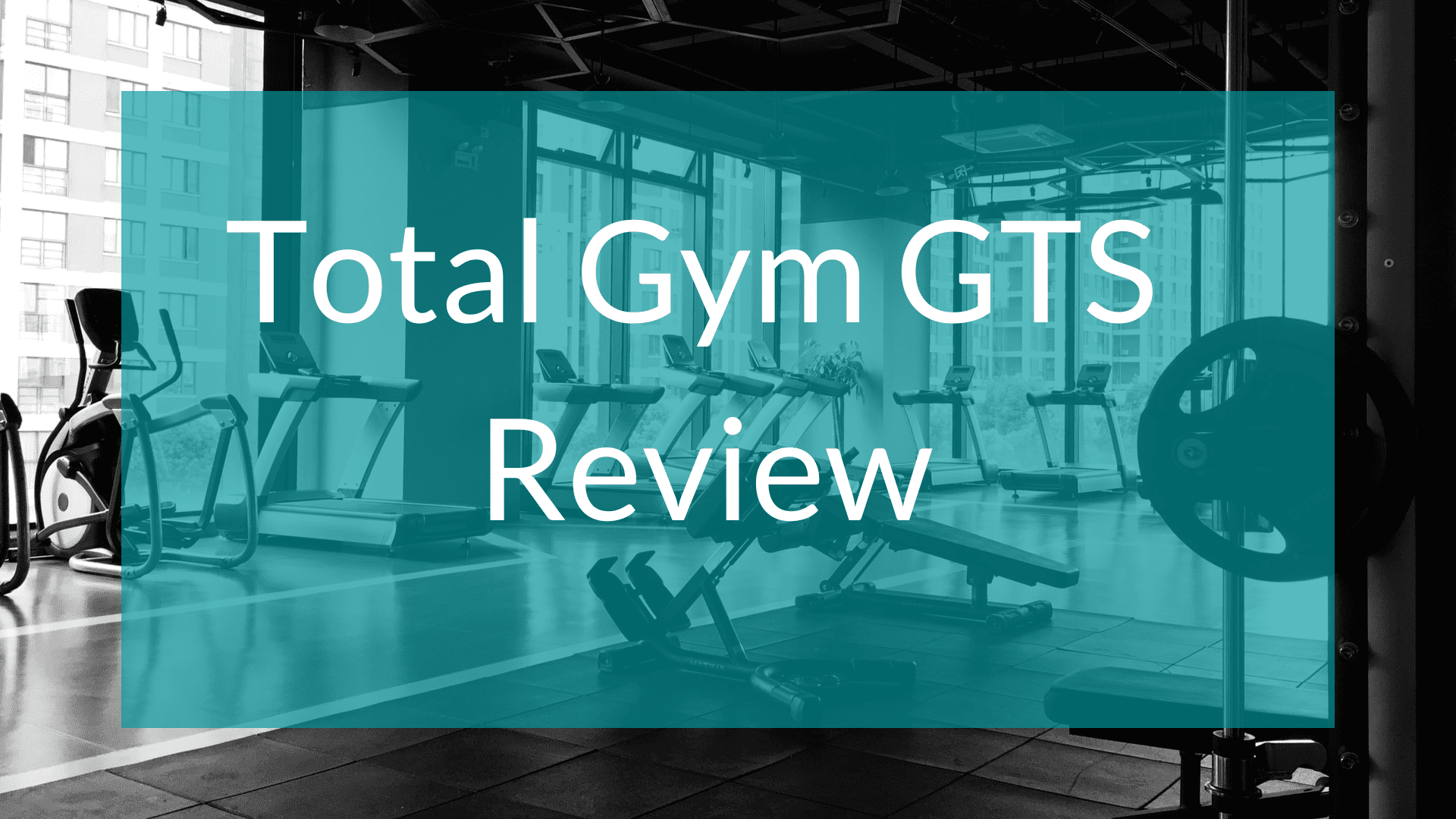 Total Gym GTS Review written in text with a gym in the background